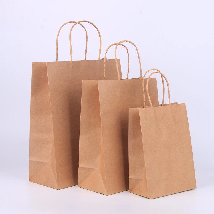 Kraft paper carry bags in three sizes with twisted paper handles